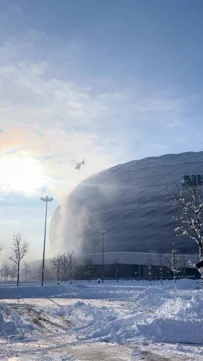 Clearing Snow off Alliance with a helicopter