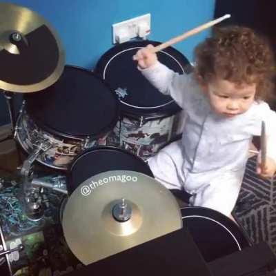 This kid was born to play the drums.