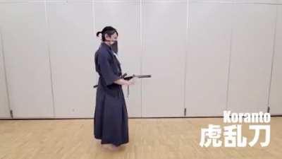 Swordswoman demonstrates differently katana strokes