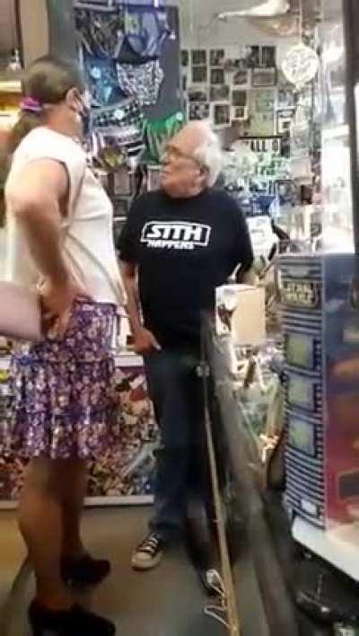 Hilrious store owner confronted by a Tranny over sign in store window.