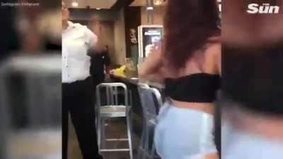 McDonald's customer throws milkshake at the worker and they start attacking eachother