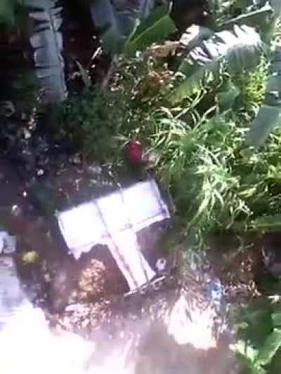 A kid jumps off the roof with a makeshift glider imitating avatar Aang.