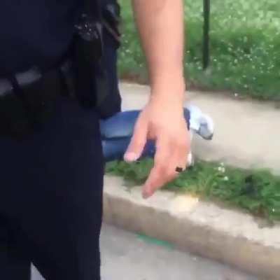 Baltimore cop points gun at man’s neck without cause.