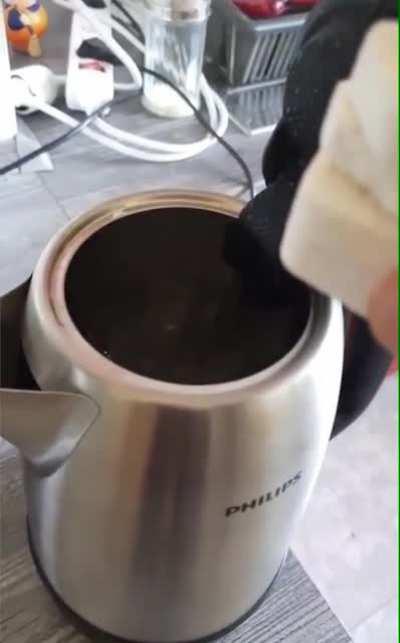 WCGW putting marshmallows in a kettle.