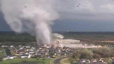 Tornado ripping through a bunch of houses.