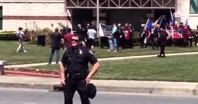 Officers smiling at &quot;White Power&quot; and &quot;KKK is here to stay&quot;