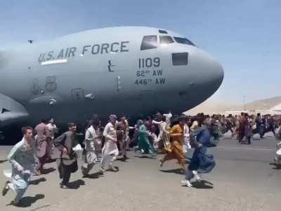 Locals cling to US Air Force plane as it takes off in Kabul