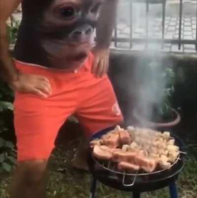 Man needs some help with the grill and his gut is there for him