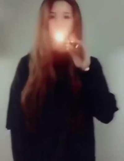 Girl does some lighter tricks