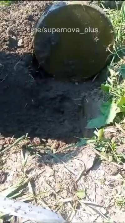 Ukrainian sappers and a Russian anti-tank mine TM-62, under which an additional trap in the form of a grenade was found during demining.