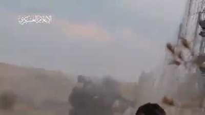 A Hamas militant with a millitary uniform (shocking) fires a RPG-7 Al yassin 105 at a Israeli tank.