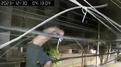 Cracked out man walks barefooted on telecommunication lines to cut cables. 