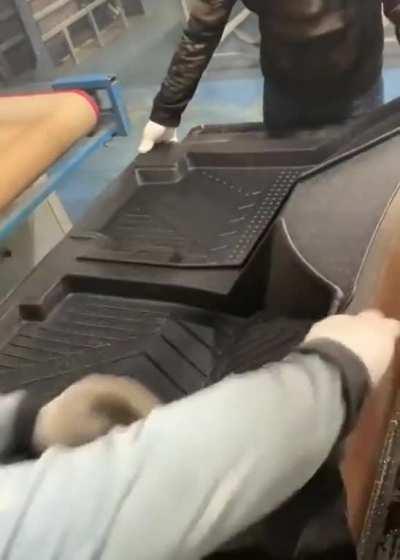 How car mats are shaped on the production line