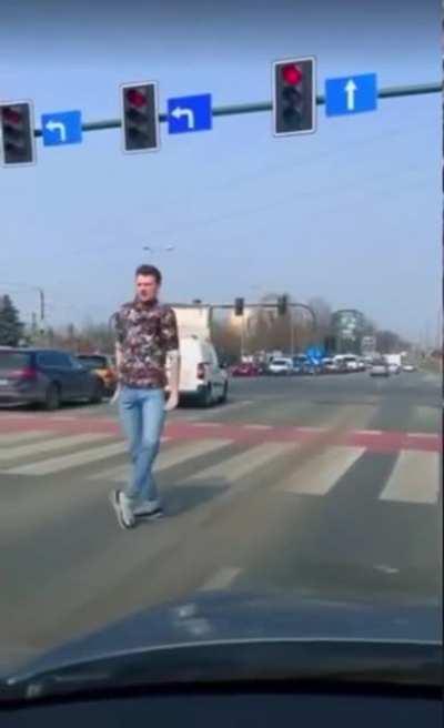 Smooth moonwalking and dance moves at a traffic light.