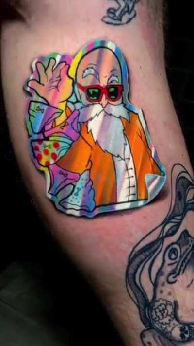 This tattoo by Clayton Dias that looks like a holofoil sticker