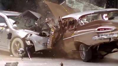 Crash test between a classic car and a modern car