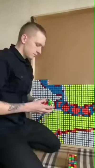 Guy makes Marge Simpsons out of rubix cubes