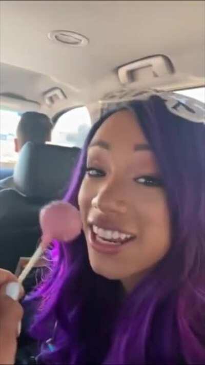 Sasha playing with Bayley's lollipop