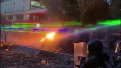 Protestors in Santiago, chile using lasers to disorient police into not shooting them