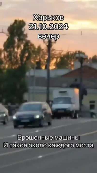 UA POV: Video from Kharkov. Caption in the video: &quot;Abandoned cars.  And such picture  is near every bridge.&quot;. The inscription on the truck: Saltovsky meat processing plant.