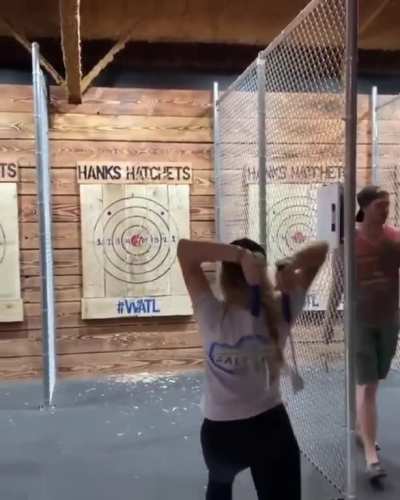 Double axe throw hitting the bull's eye