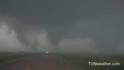 Multiple vortices are seen rotating around during the formation of a tornado near Tilston, Manitoba. 7/27/2015