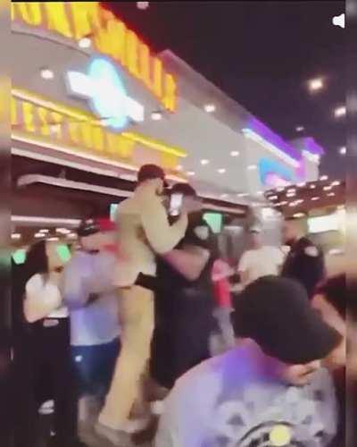 Massive security guard ejects douchebag from club like a cardboard cutout.