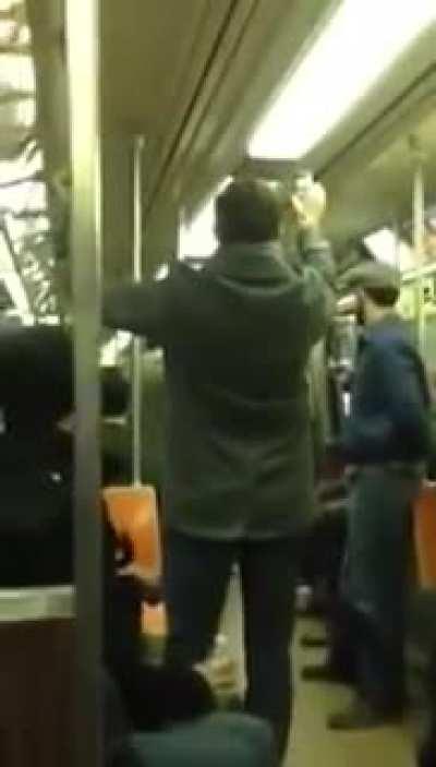 Two Strangers Having a Saxophone Battle on Train