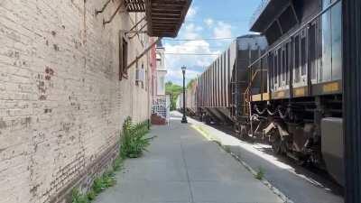 CSX B765, a local freight which serves an industry near Hudson, NY, street-running on S. 7th Street