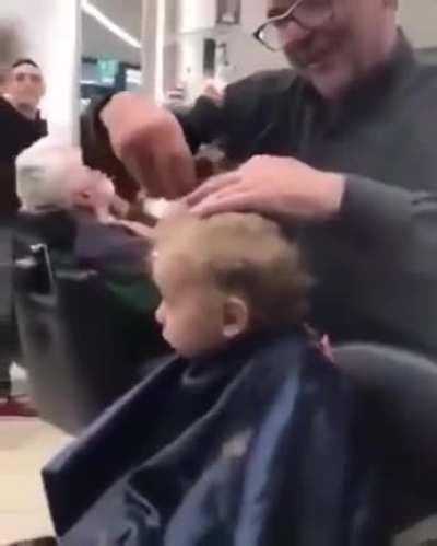 Barbers help sooth scared child by singing an Italian nursery rhyme