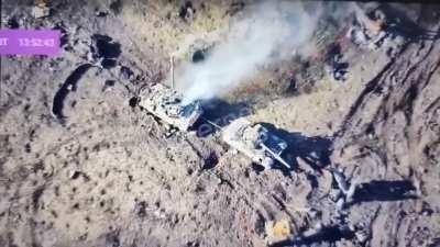 Russian soldiers take cover by some destroyed vehicles in the Avdiivka area and are hit by Ukrainian forces