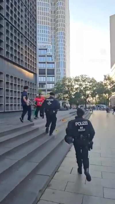 German police chase and arrest a 10-year-old boy with a Palestinian flag at a protest in Berlin