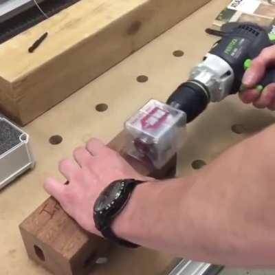 Turning screws inside a piece of wood using a magnetic drill