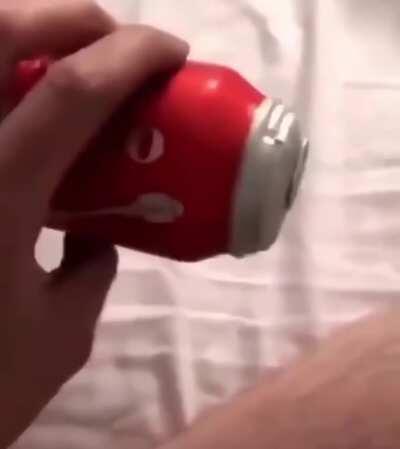 Opening an inflated can of coke