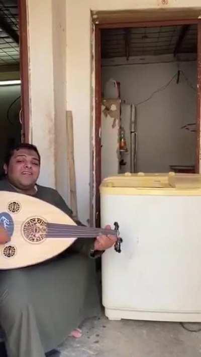 Mixing sound comes out from an old washing machine with his Oud