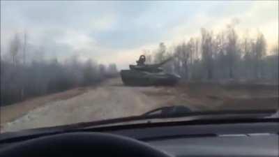 Guy plays chicken with a tank