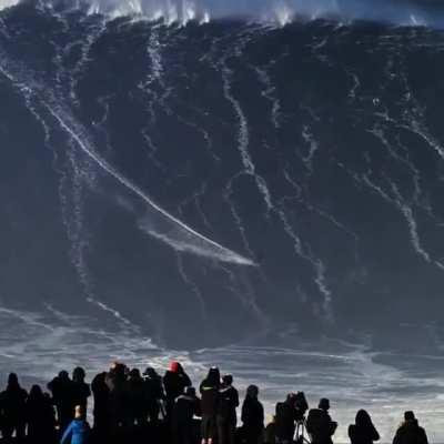 This guy surfing a wave over 115 feet tall (Credit: @javier.goya)