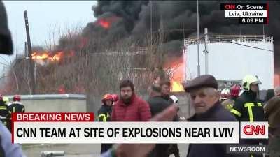 CNN reporting near the oil depot in Lviv which was hit by Russian missiles.