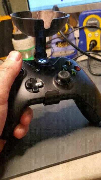 An Xbox One controller ashtray attachment.