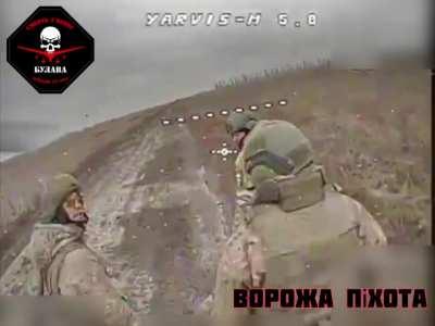 RUBPAK “BULAVA” 72 OMBr FPV drone strikes a trio of Russian soldiers walking along a road.