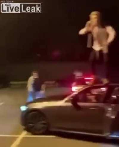 Man Jumps off Roof of Car and Lands on his Balls