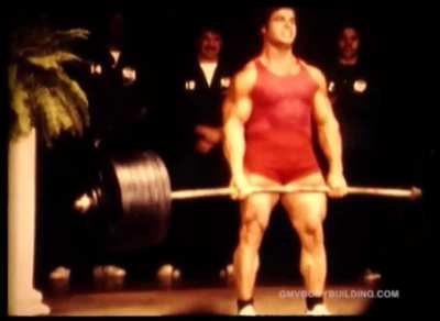 Franco Columbu shows his strenght by doing 700 pounds, for reps. Early 1970s.