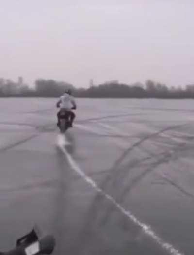 WCGW driving a motorcycle on ice.