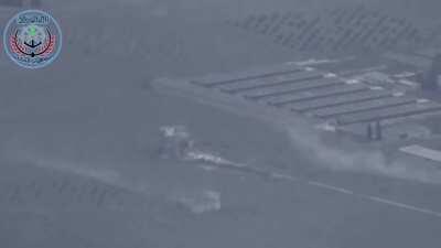 A T-55 tank from the FSA's 1st Coastal Division targets a distant building in Syria