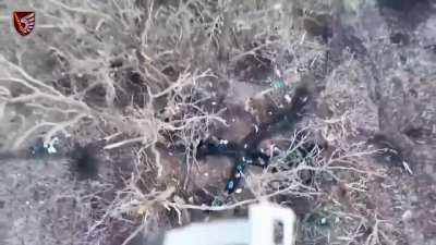 An Ukrainian drone drops a grenade into a Russian trench, hitting a fuel tank. Donetsk Oblast