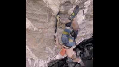 Professional rock climber Adam Ondra performs a &quot;knee bar&quot; to bring the blood flow back to his arms.