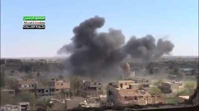 Cameraman films an incoming SyAAF air strike on Opposition controlled al-Huwayqa Neighborhood, Deir ez-Zor - 3/18/2013