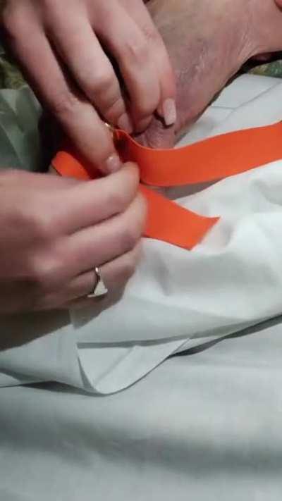 Removing a ring, that's stuck on a finger, using a tourniquet