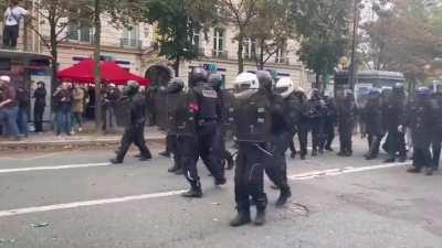 In France, police rush out to the people, expecting them to rush and create a stampede. No one moves and the police are forced to back down