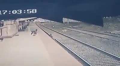 Blind mother's child falls onto tracks in front of incoming train.